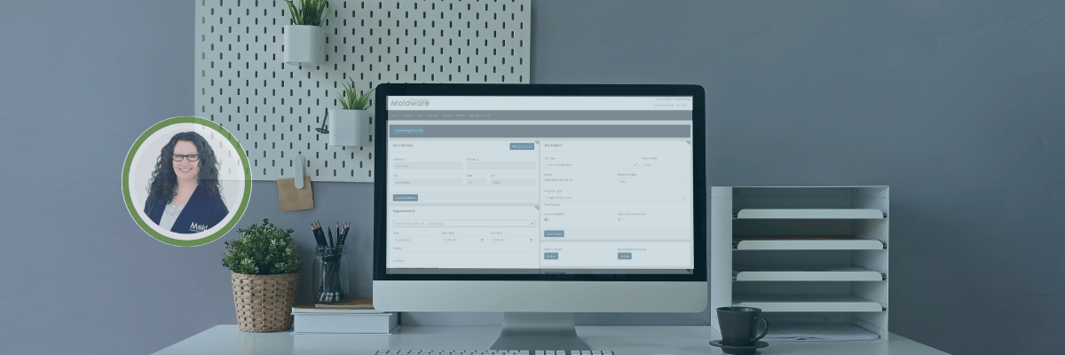 A modern office desk with a computer displaying assessment software on the screen. There’s a potted plant, a cup of pens, and an organized paper tray. A circular inset shows a smiling woman with long dark hair and glasses in business attire.